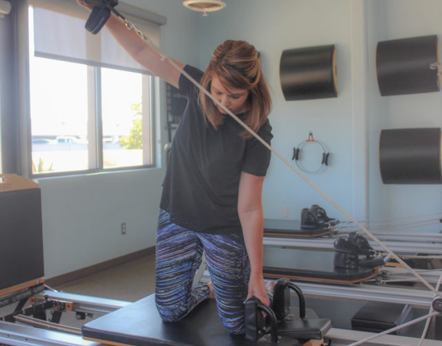 woman active on a reformer
